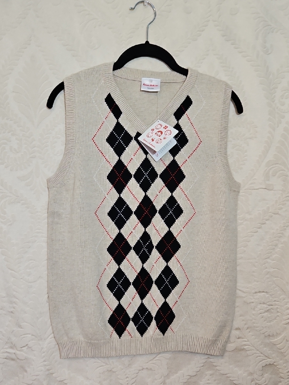 Hanna Andersson Cream Argyle V-Neck Sweater Vest with Black and Red Accents